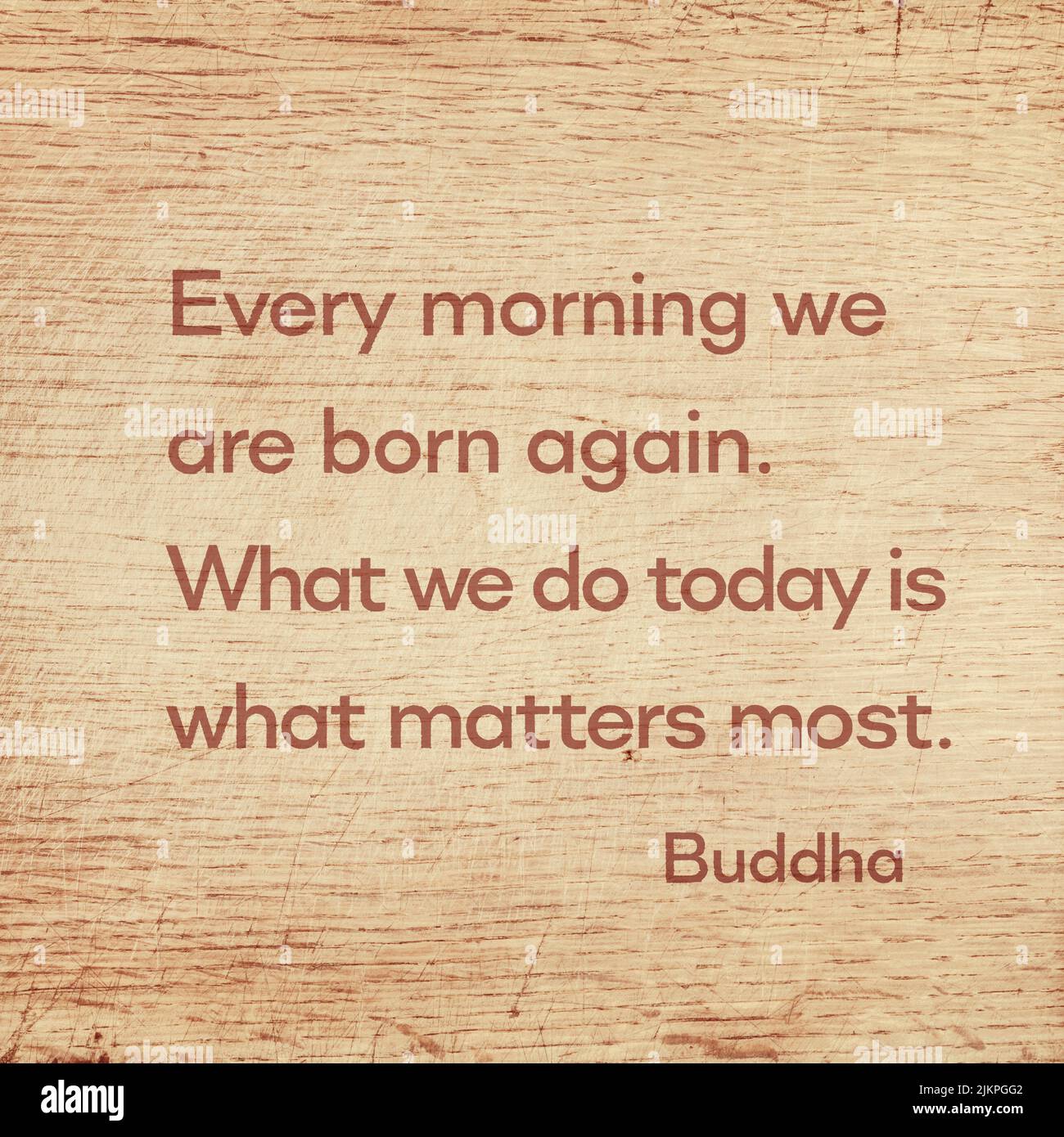Every morning we are born again. What we do today is what matters most - famous quote of Gautama Buddha printed on grunge wooden board Stock Photo