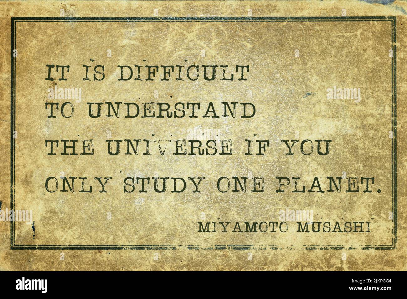 It is difficult to understand the universe if you only study one planet - ancient Japanese swordsman and ronin Miyamoto Musashi quote printed on grung Stock Photo