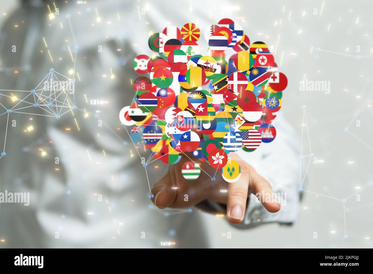 A person's hand touching the flags of the world countries from the background Stock Photo