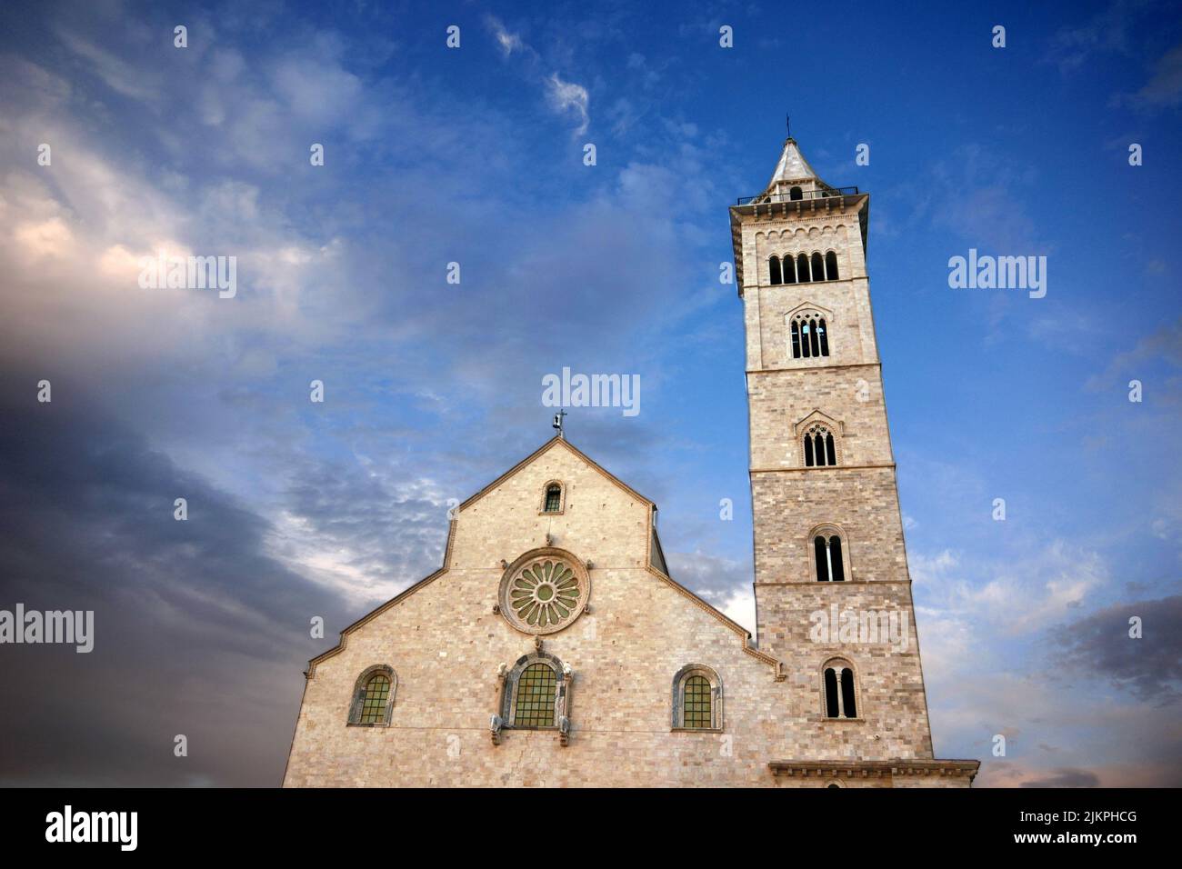 A low angle of an old church under a cloudy blue sky Stock Photo - Alamy