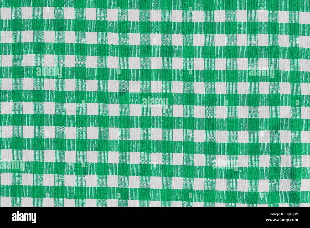 Old Retro Natural Classic Design Linen Plaid Fabric Tablecloth. Abstract Background, Green White Colors. Old Retro Natural Classic Design Linen Plaid Stock Photo