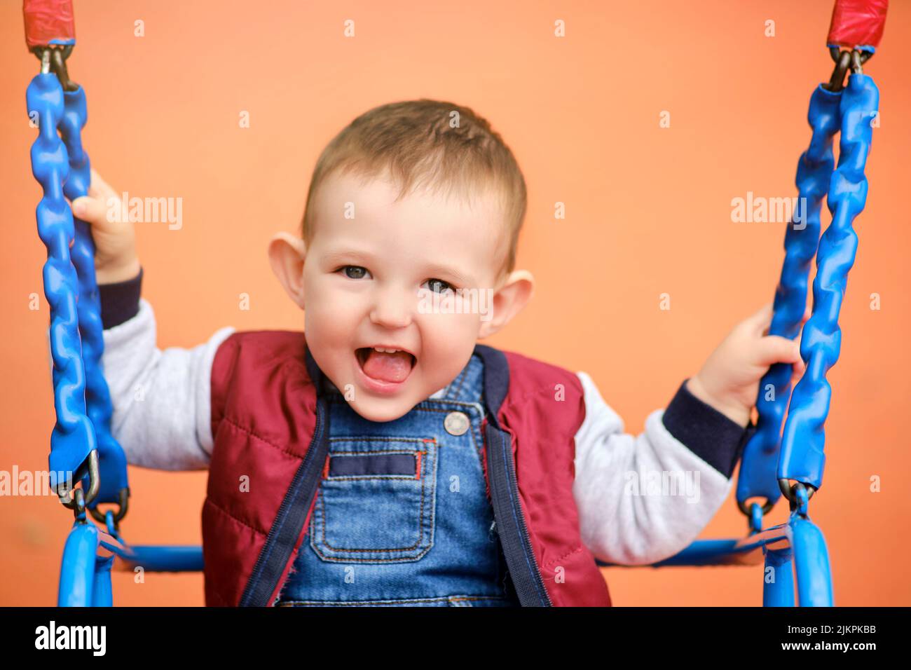 Happy baby rides on swing hi-res stock photography and images - Alamy