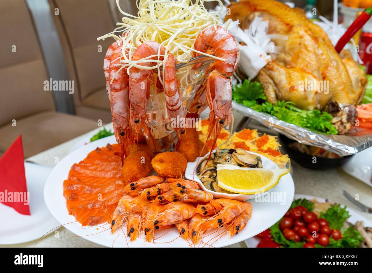 Serving a table in a restaurant with various seafood Stock Photo - Alamy
