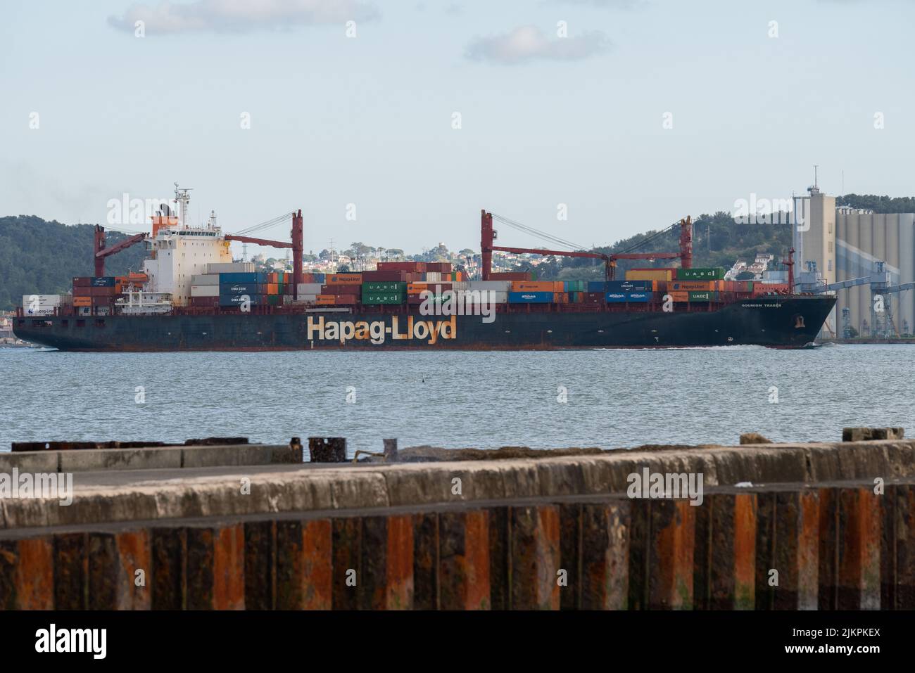 A cargo ship of the company Hapag Lloyd transporting containers ...