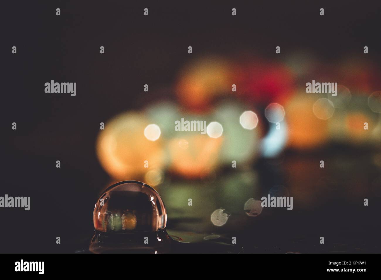 A water bead on a blurred background Stock Photo