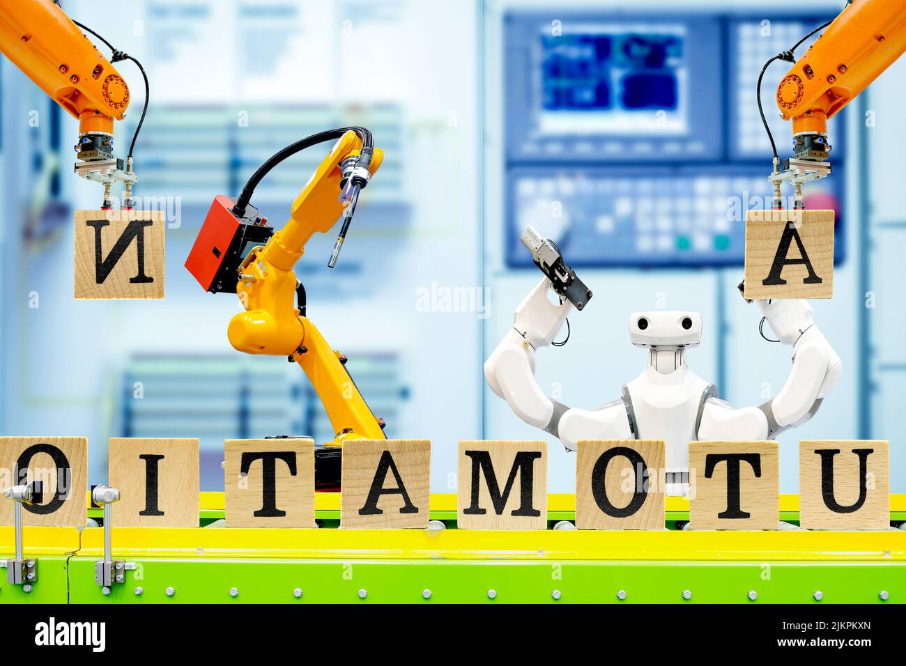 Automation concept idea, smart robotic team working with wooden cube letters on smart factory Stock Photo