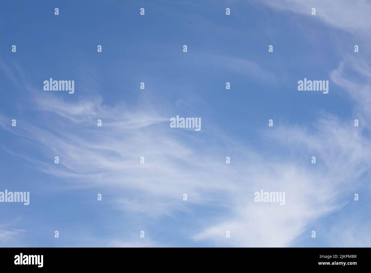 Blue sky with white little cirrus clouds. Stock Photo