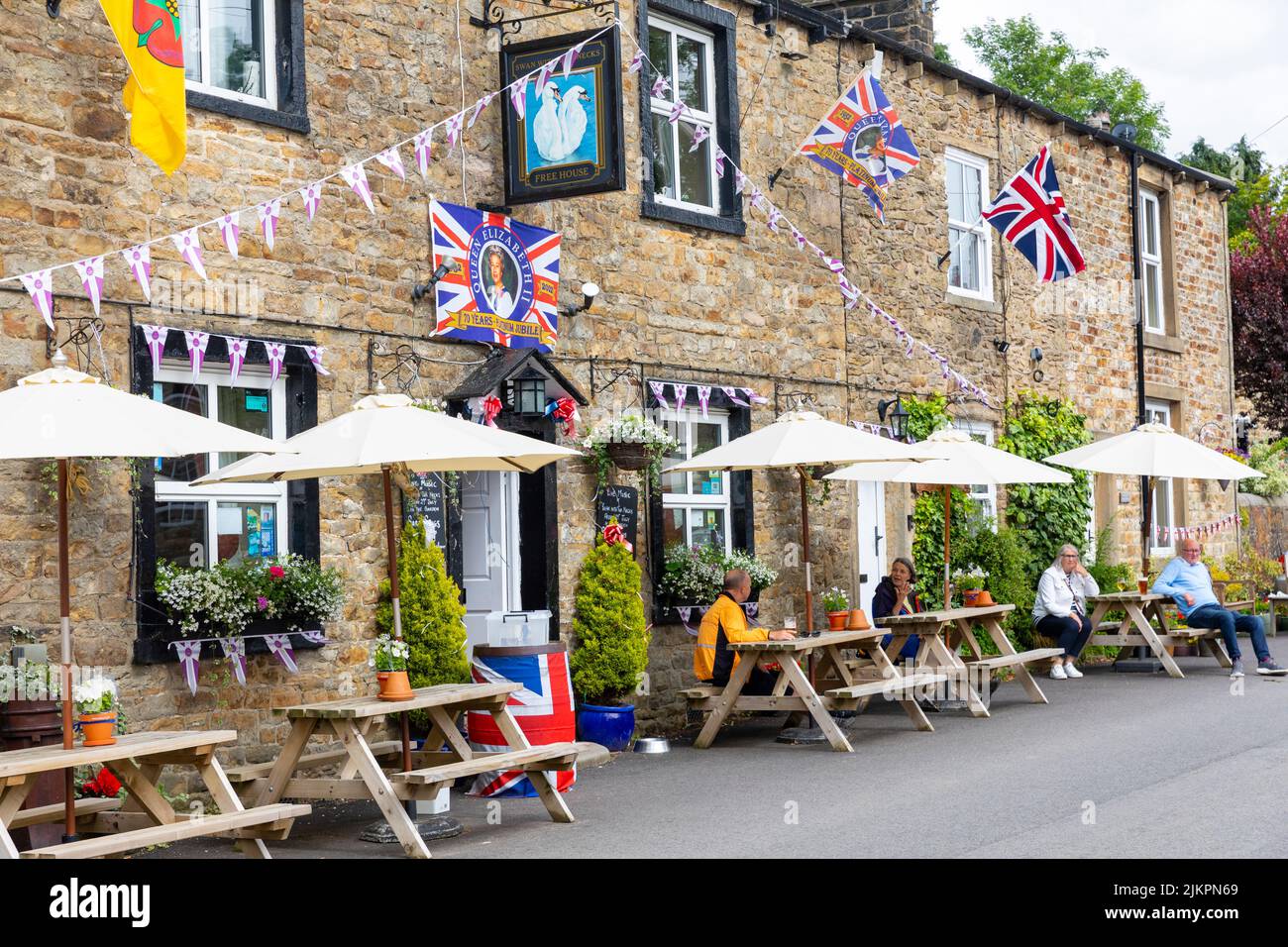 Platinum celebrations for Queen Elizabeth at the Swan with two Necks pub in Pendleton, village in Lancashire,England,UK with union jacks displayed Stock Photo