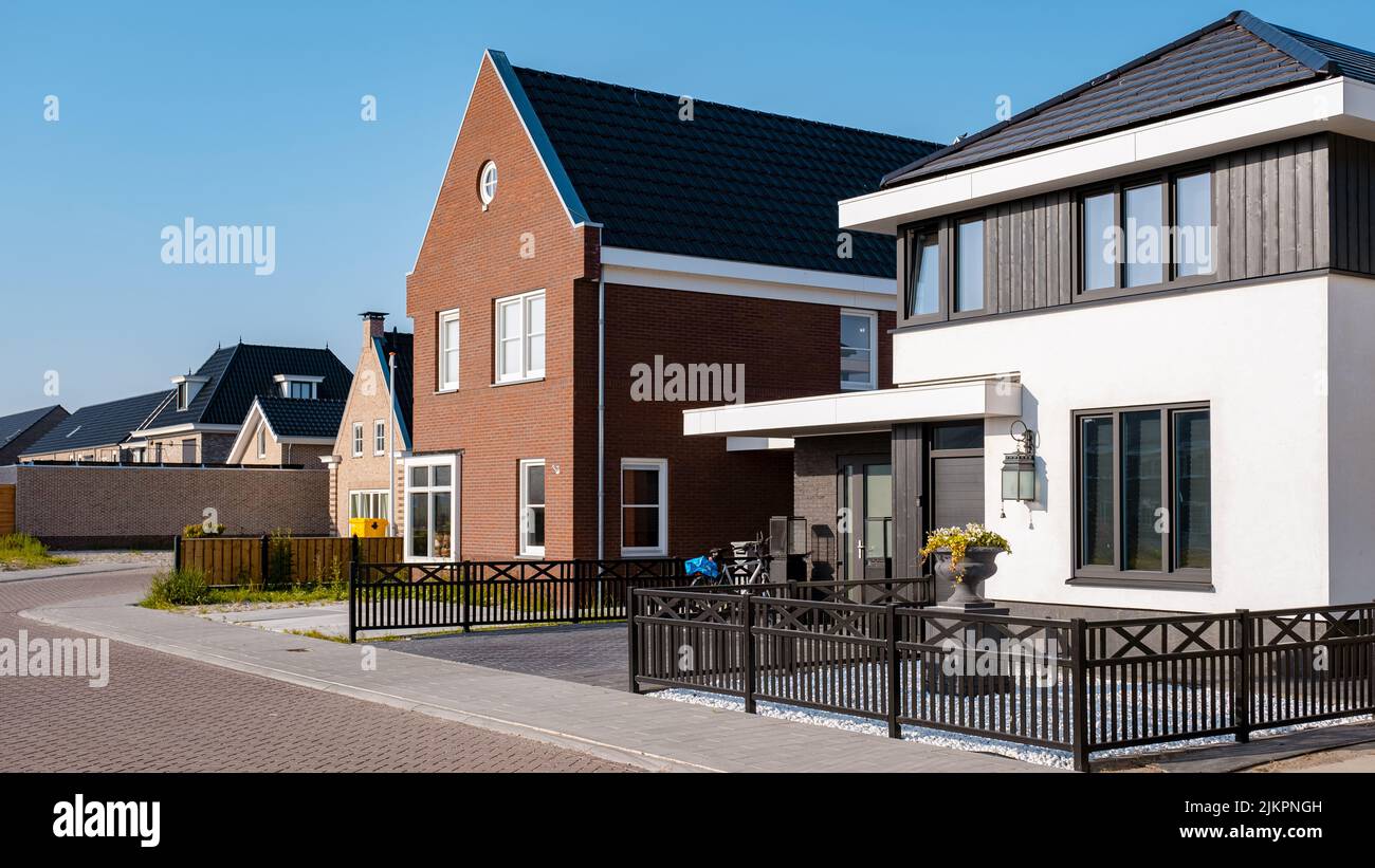 Dutch Suburban area with modern family houses, newly build modern family homes in the