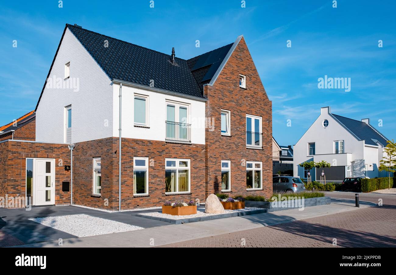 Dutch Suburban area with modern family houses, newly build modern family homes in the