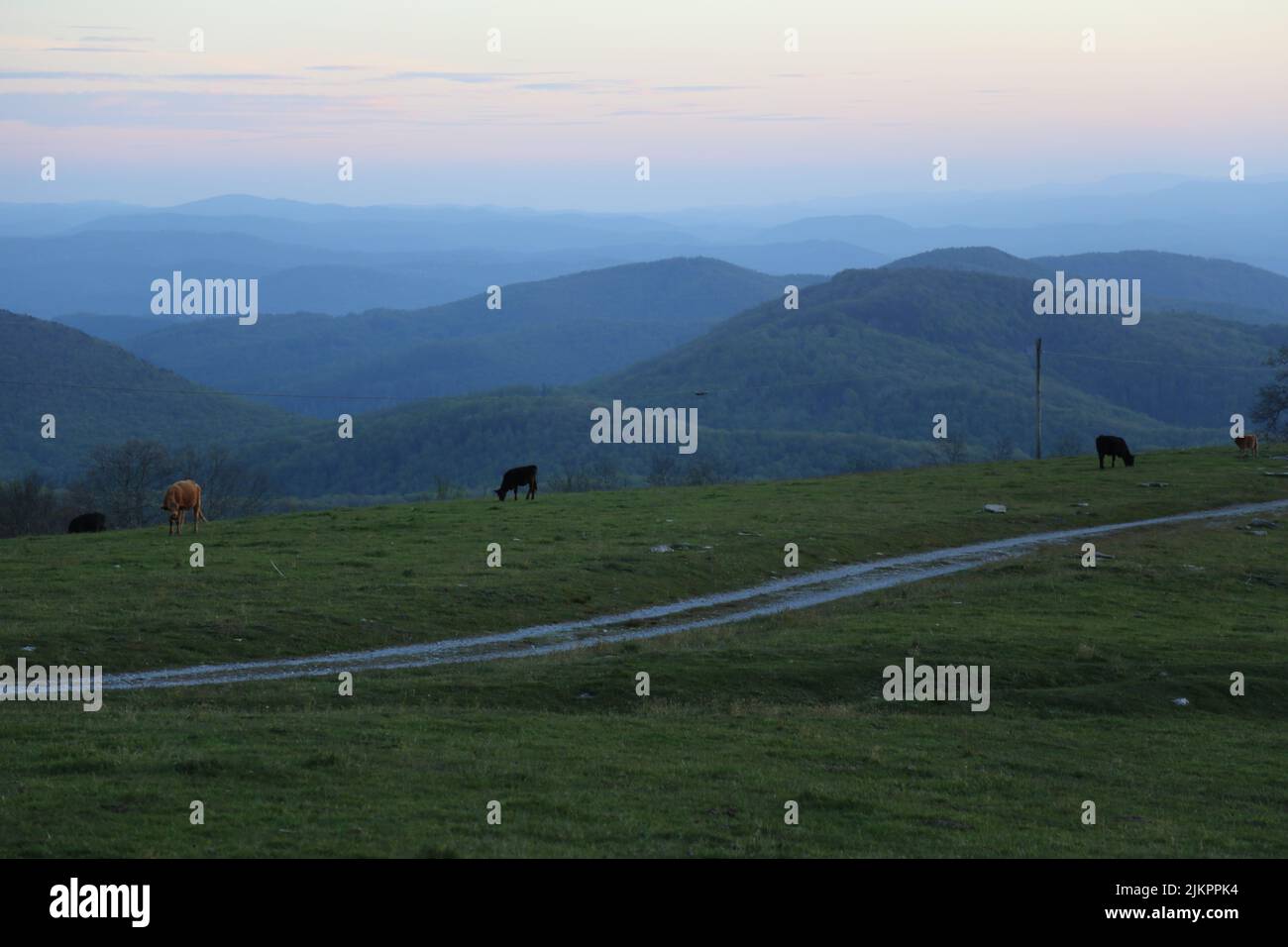 An aerial shot of beautiful mountains during the sunset Stock Photo - Alamy