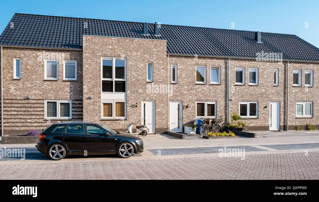 Dutch Suburban area with modern family houses, newly build modern family homes in the