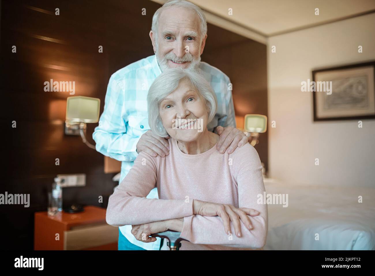 Two senior people smiling and looking happy together Stock Photo