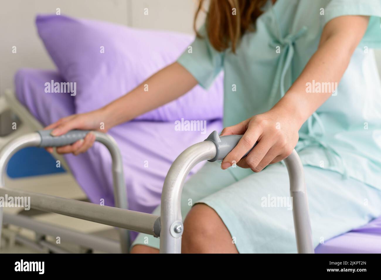 Hospital patient with a walking frame Stock Photo