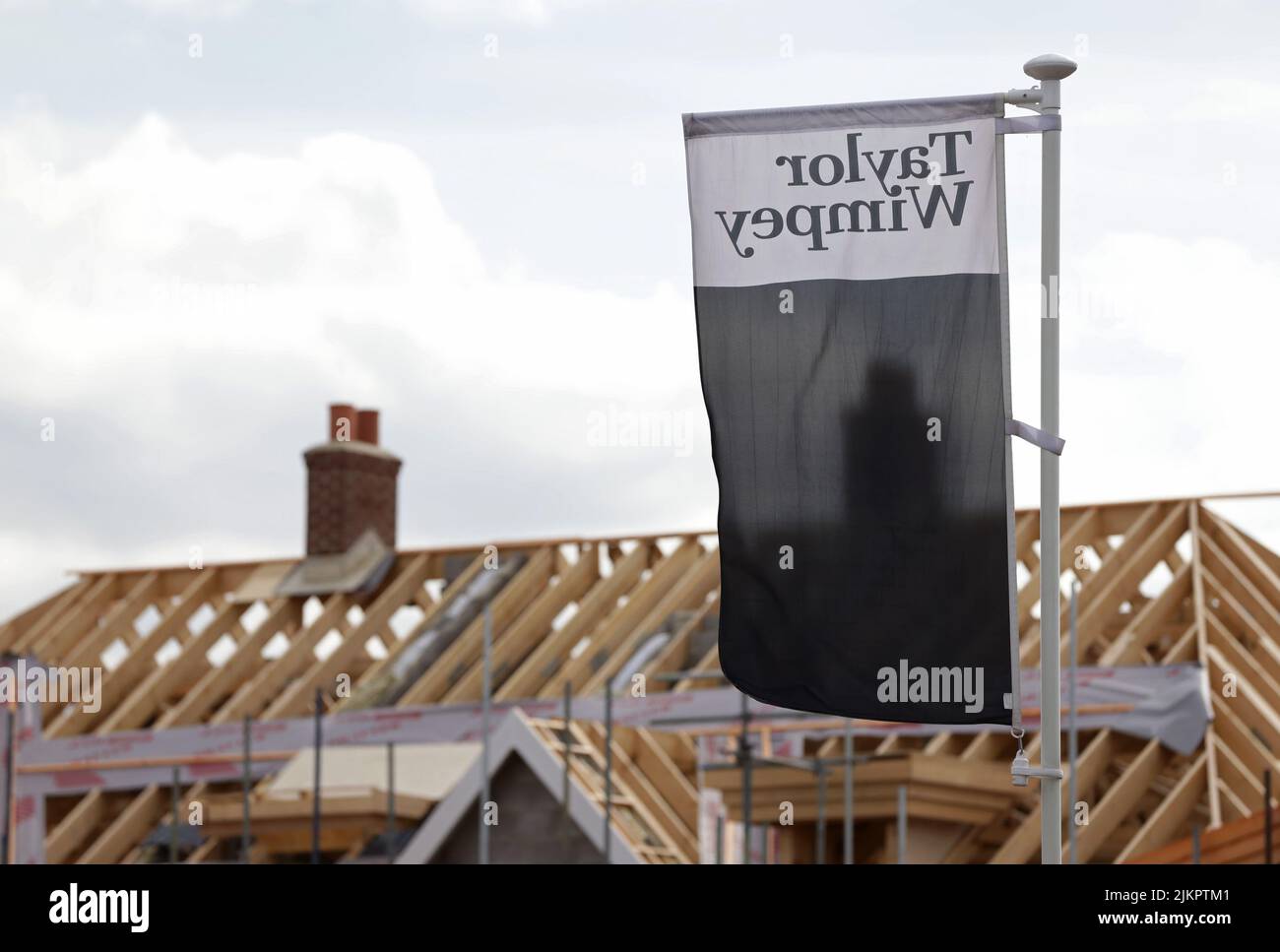 File photo dated 27/03/15 of Taylor Wimpey houses under construction. The housebuilder has announced a cost-of-living payment of up to £1,000 to help staff with soaring fuel costs. The group said it will make the payment to all employees on salaries of up to £70,000, meaning that around 90% of its workforce are eligible. Issue date: Thursday March 3, 2022. Stock Photo