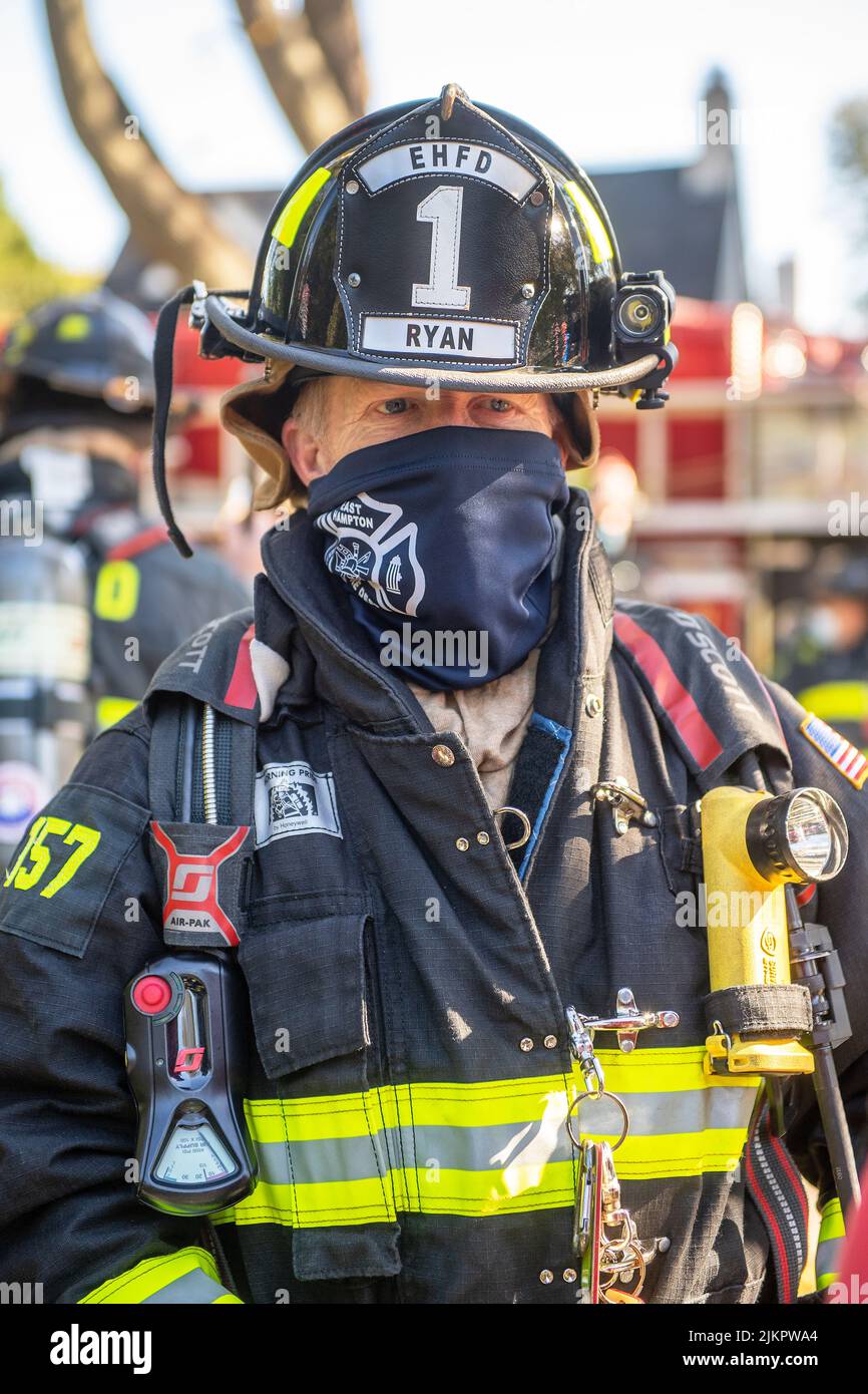East Hampton firefighter John Ryan, Jr. wears a gaitortype mask to