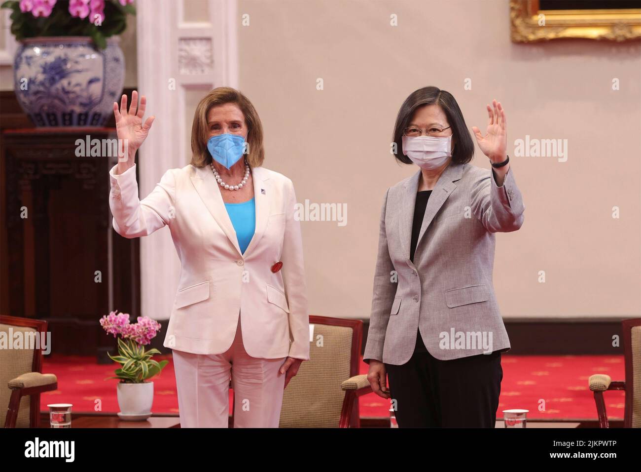 Taipei, Taiwan. 03rd Aug, 2022. Taiwan President Tsai Ing-wen, right, and U.S. Speaker of the House Nancy Pelosi, wave during a meeting at the presidential office, August 3, 2022 in Taipei, Taiwan. Pelosi is leading a delegation of congressional leaders in a visit that has angered China. Credit: Simon Liu/Taiwan Presidential Office/Alamy Live News Stock Photo
