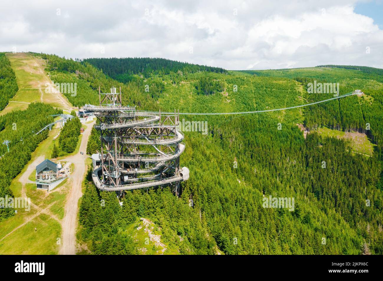 Aerial view of the worlds longest 721 meter suspension footbridge Sky bridge and observation tower the Sky walk in the forest, between mountains, Dolni Morava Ski Resort, Czech Republic.  Stock Photo