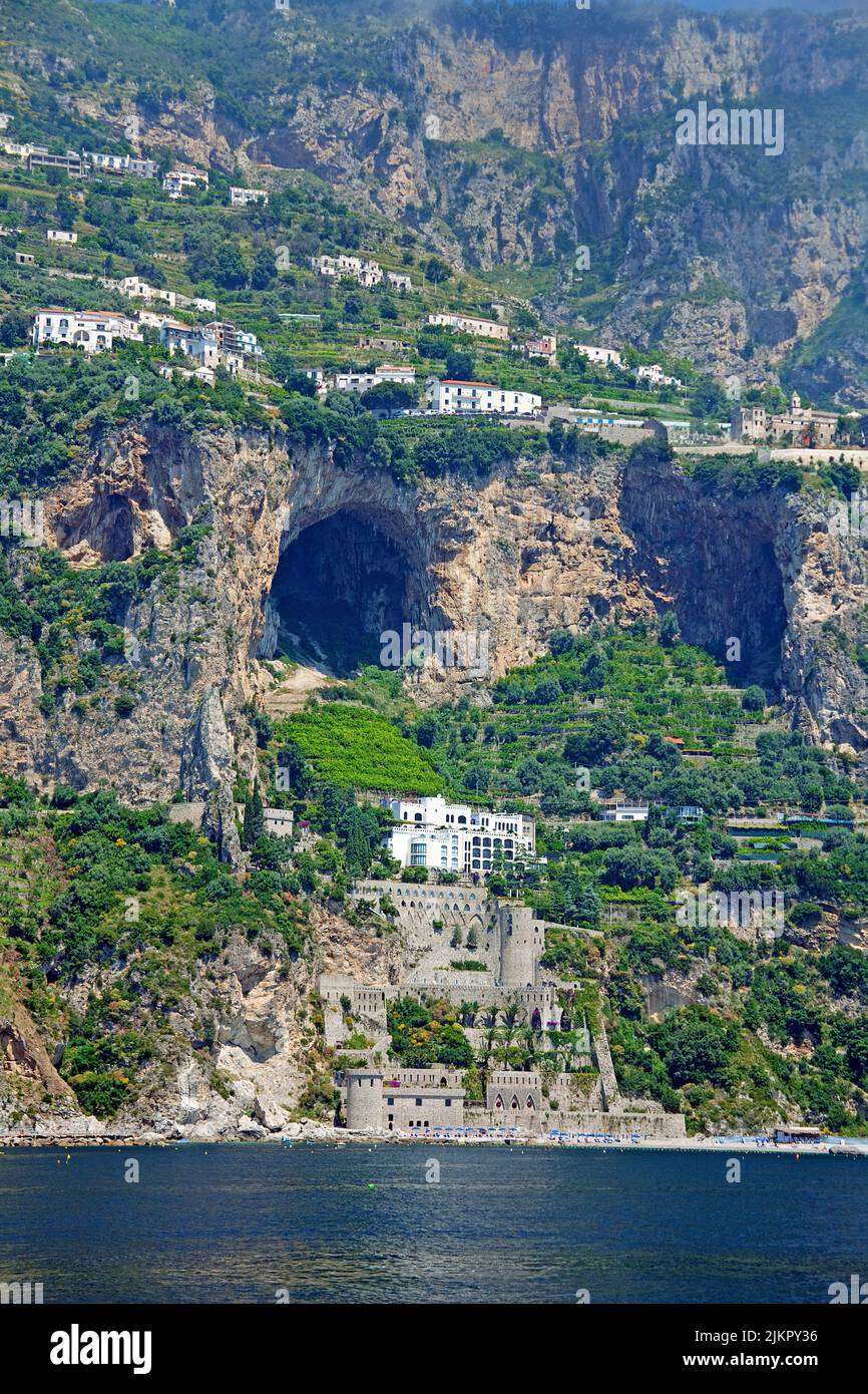 Castle and caves at the steep coastline of Amalfi coast, Unesco World Heritage site, Campania, Italy, sea, Europe Stock Photo