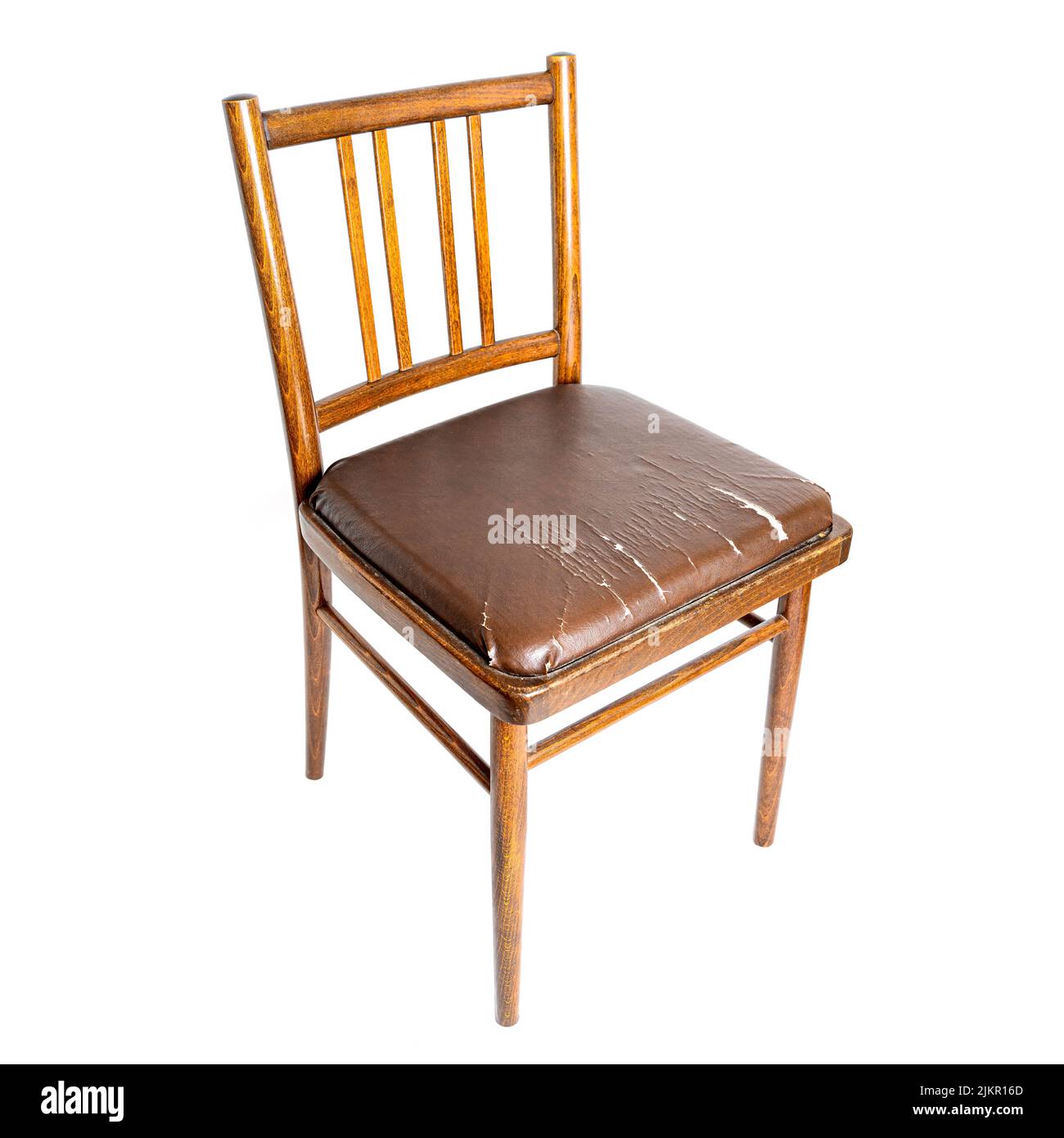 Old dining chair with a worn out seat isolated on white background Stock Photo
