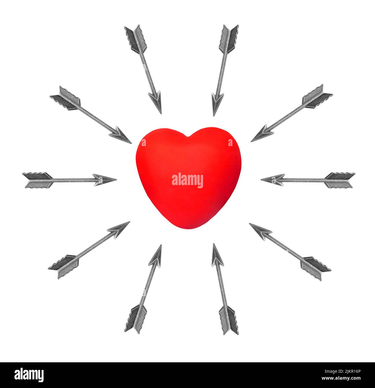 Group of feathered bow arrows aimed at a red heart shape placed in the center on a white background. Heart attack risk factors and symptoms. Stock Photo