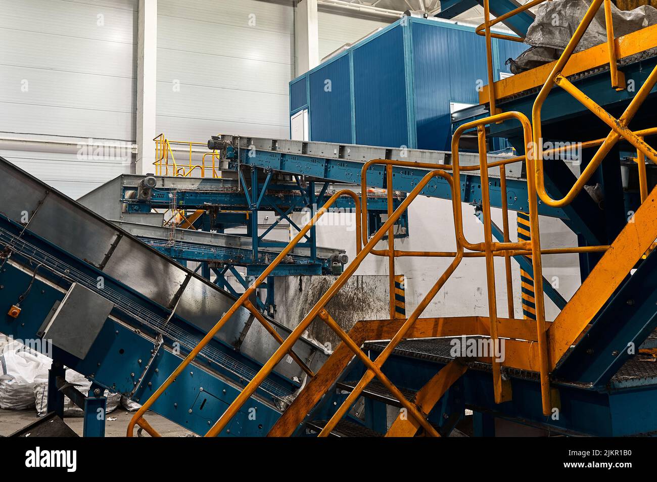 Large conveyor lines plant for sorting and processing household waste. Stock Photo