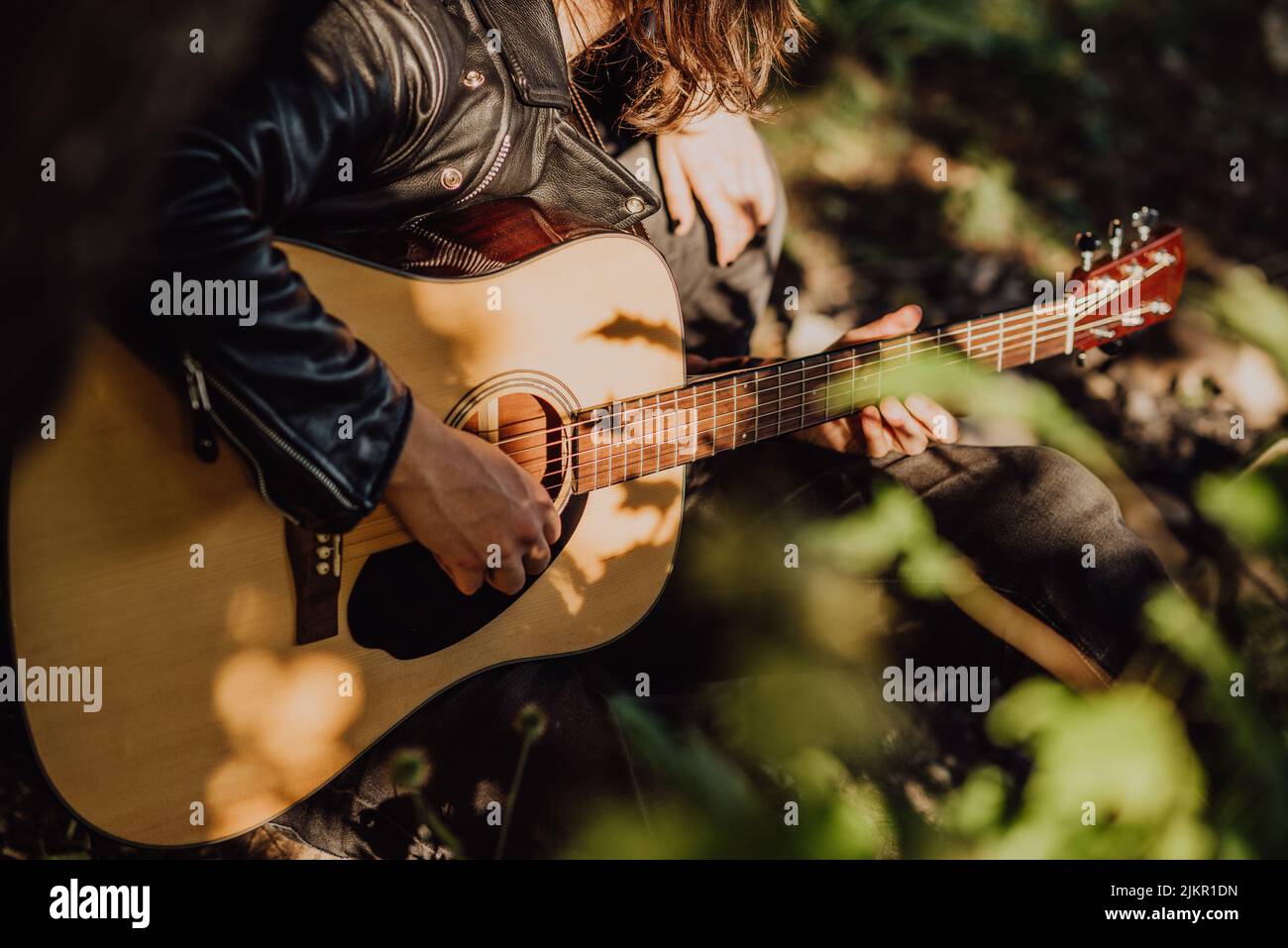 Young man close guitar outside hi-res stock photography and images - Alamy