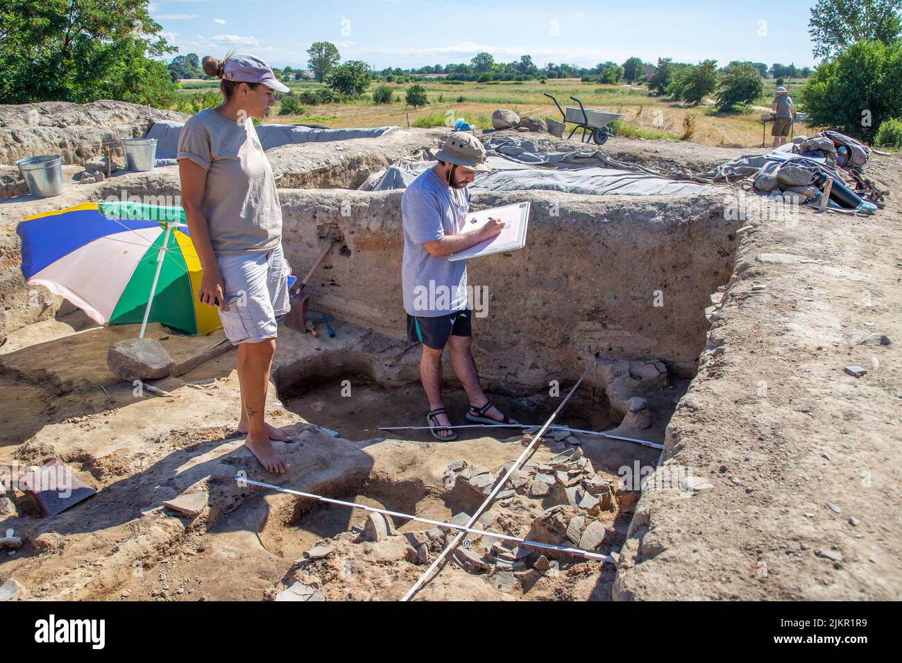 Yunatsite, Bulgaria - August, 02 2022: Archaeologists are working at Tell Yunatsite dig site. Stock Photo