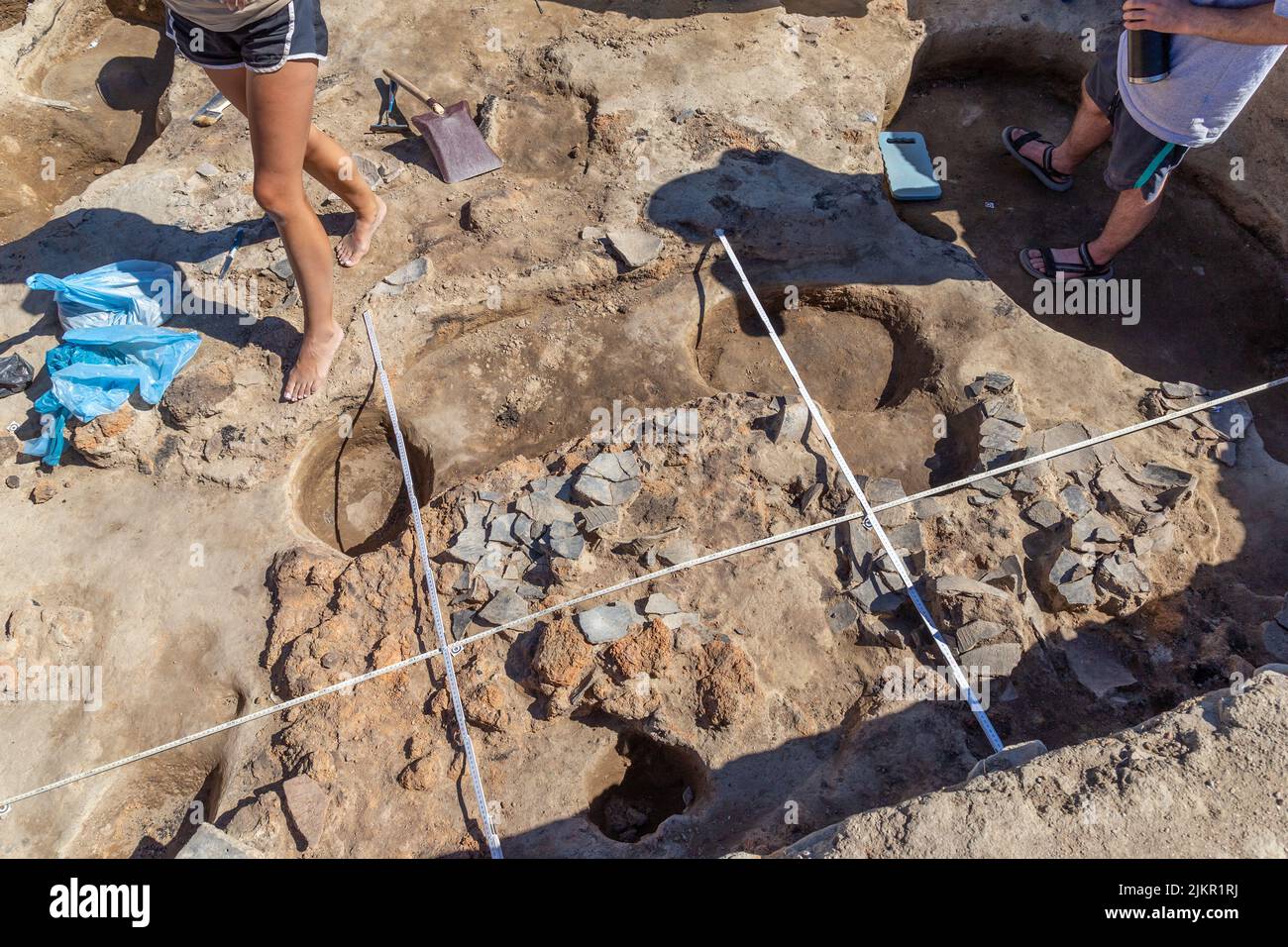 Yunatsite, Bulgaria - August, 02 2022: Archaeologists are working at Tell Yunatsite dig site. Stock Photo