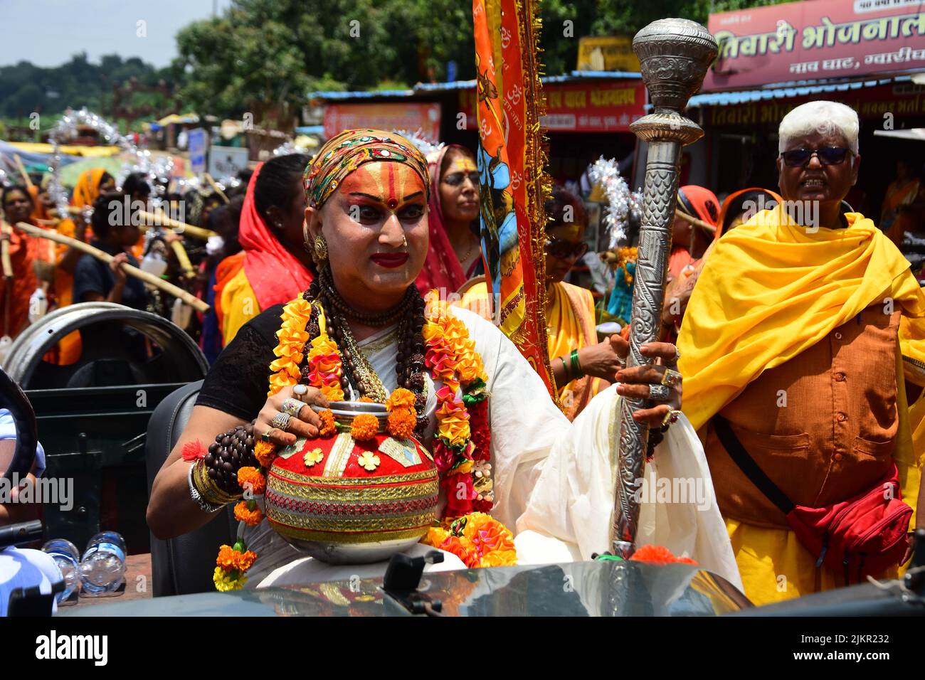 India : Maha mandleshwar Himangi sakhi (Holy Transgender) carries the water collected from the Narmada river during the month of shravan festival in Jabalpur Madhya Pradesh. Photo by - Uma Shankar Mishra Stock Photo