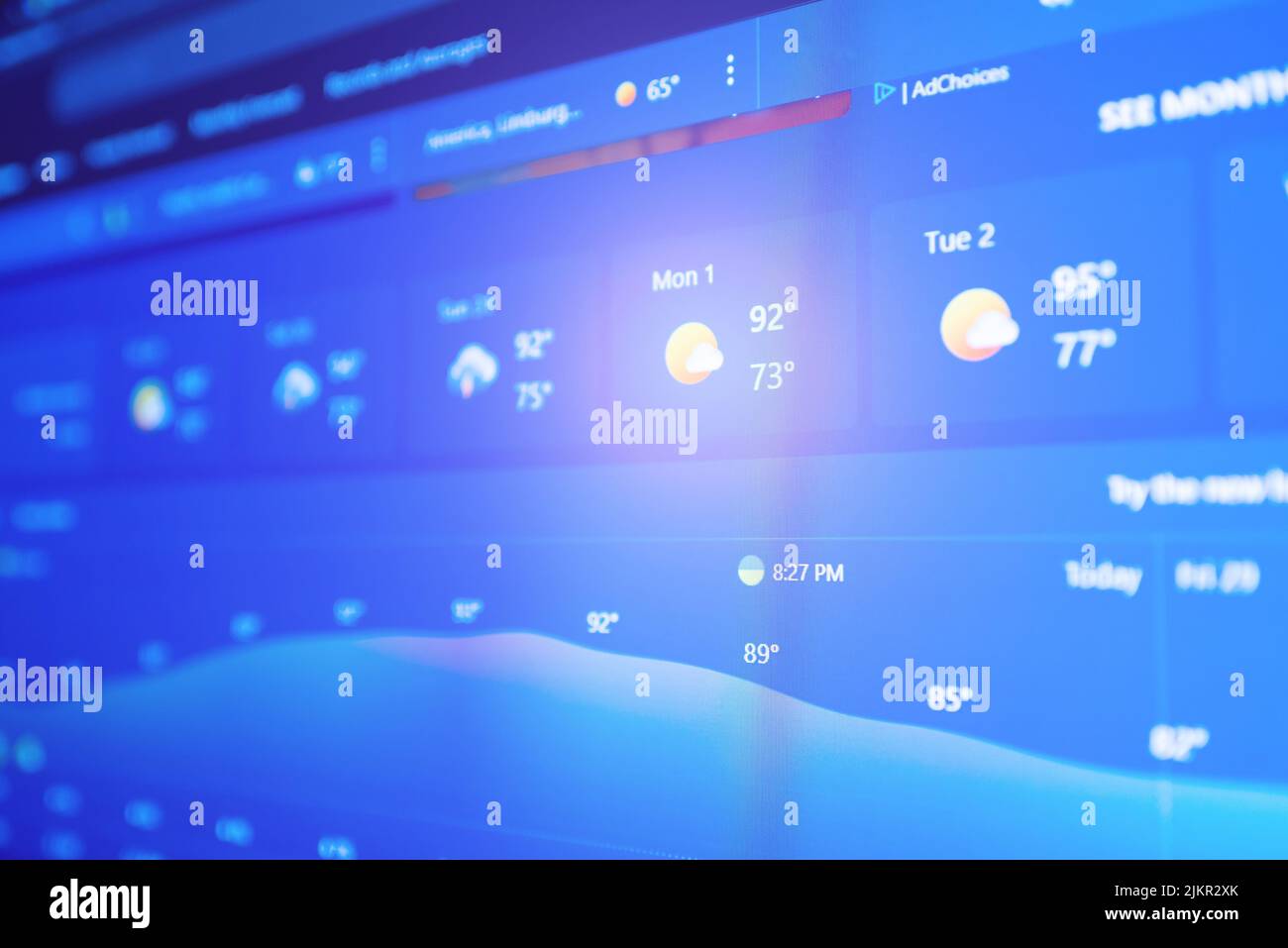 Weather forecast interface on a digital display showing hot weather for ...