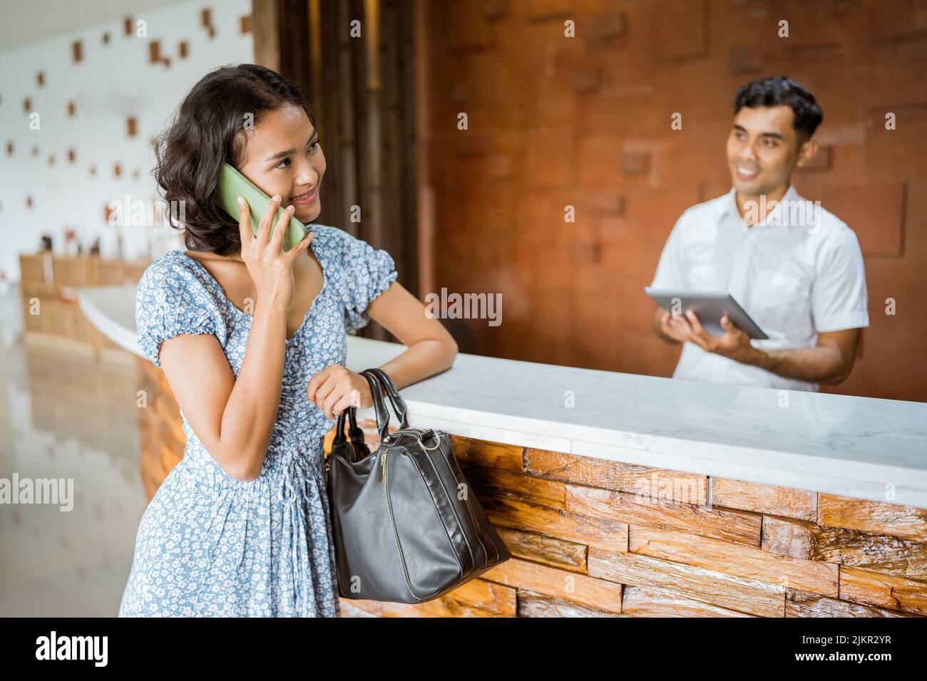 Indonesian resort receptionist hi-res stock photography and images - Alamy