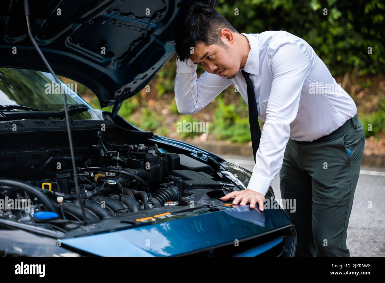 Asian businessman car broken breakdown, young stressed man having