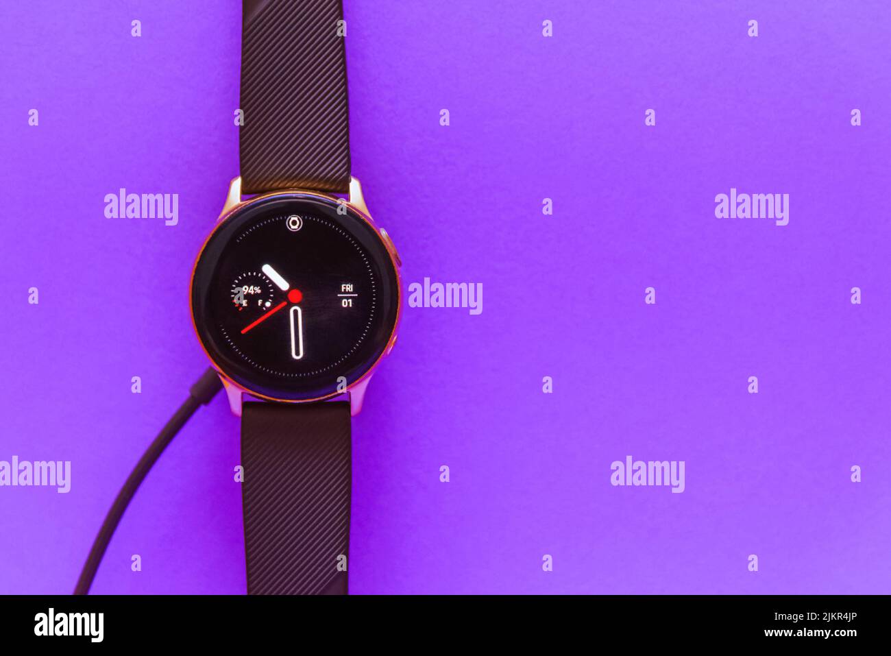 Smartwatch charging.Smart watch on wireless charging with onscreen