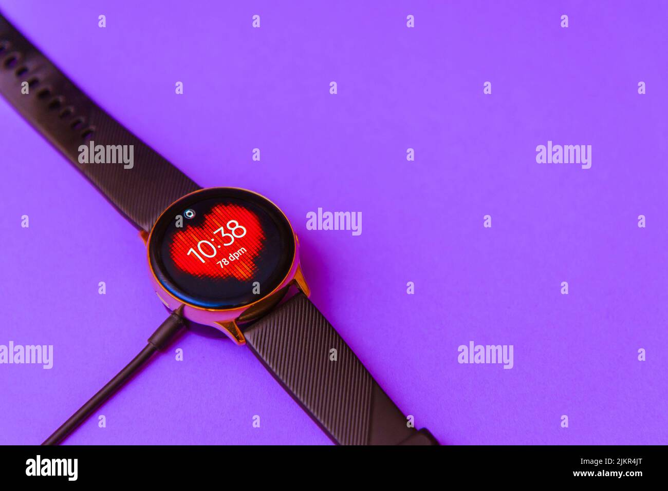 Smartwatch charging.Smart watch on wireless charging with onscreen