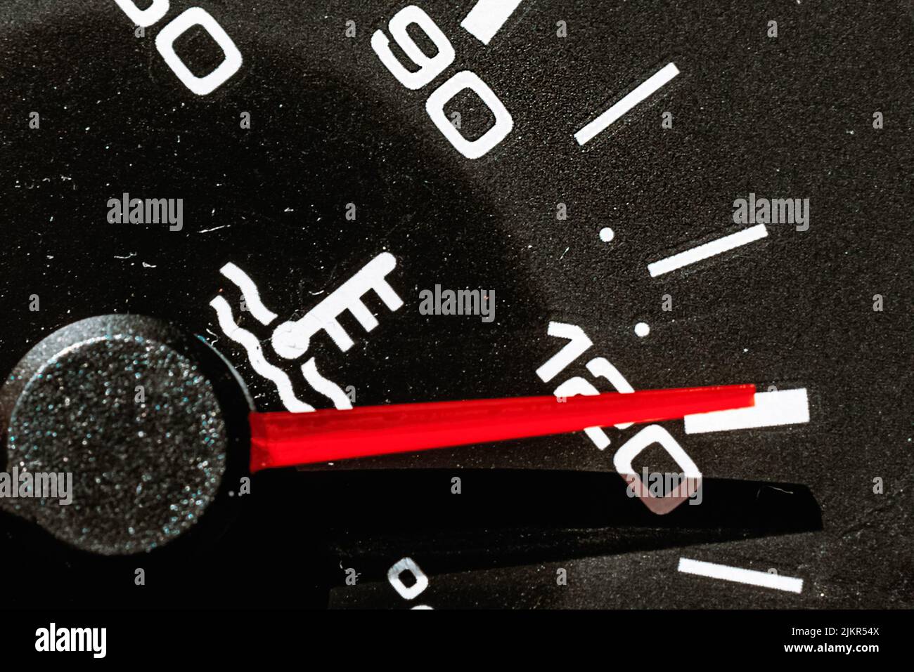Temperature gauge in a car dashboard showing hot.close up Stock Photo