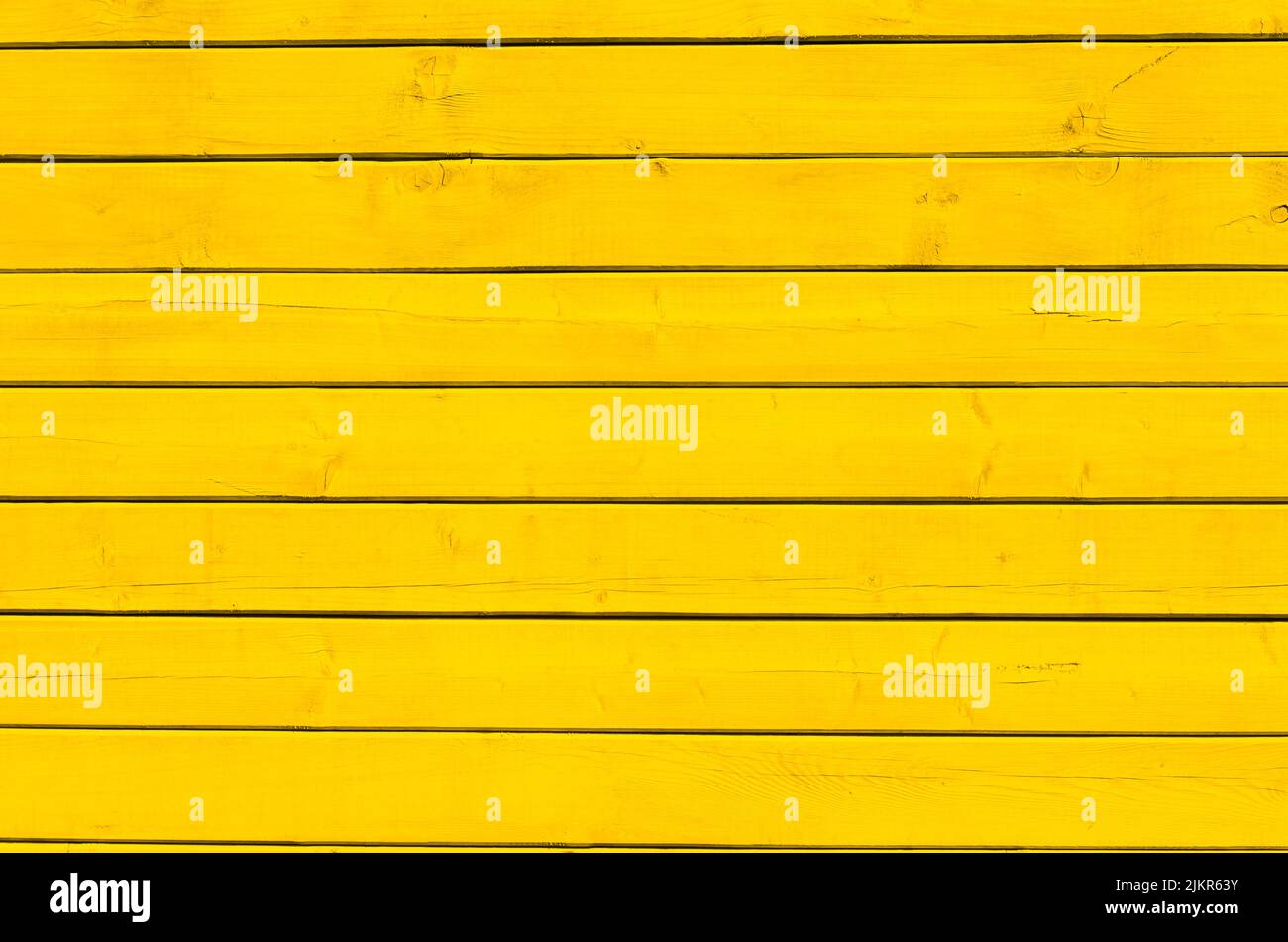 Surface of wooden boards painted with yellow paint. Yellow wood wall
