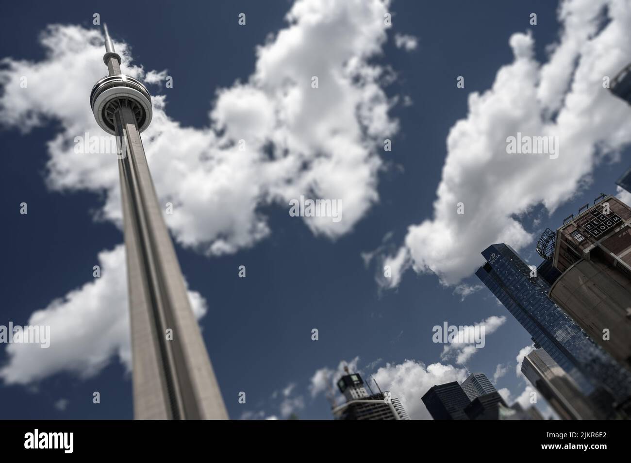 Looking up at the impressive CN Tower from ground level near Rogers Centre, Toronto, Ontario, Canada. Stock Photo