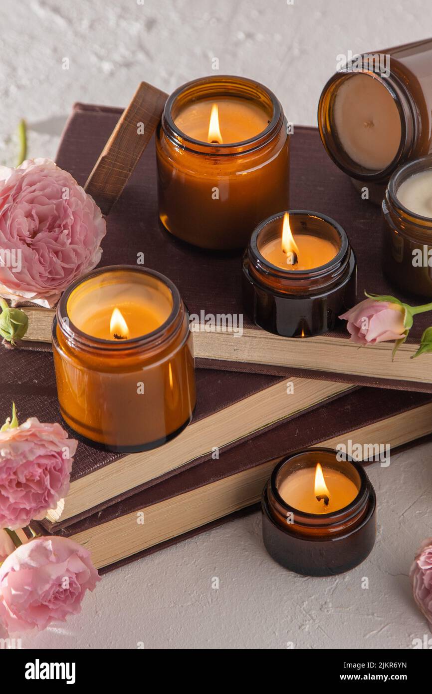 A set of different aroma candles in brown glass jars. Scented handmade ...