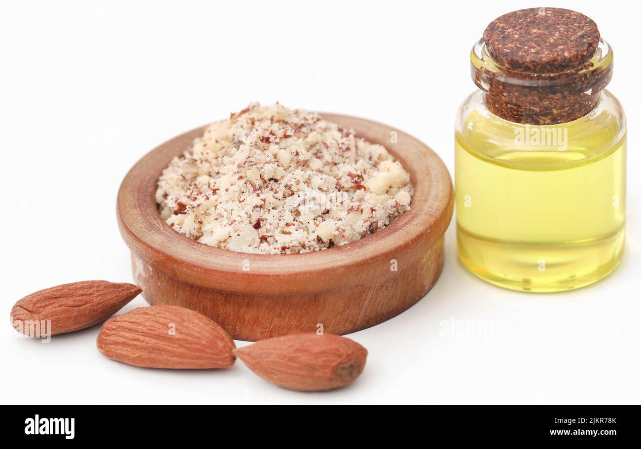 Aalmond and essential oil over white background Stock Photo