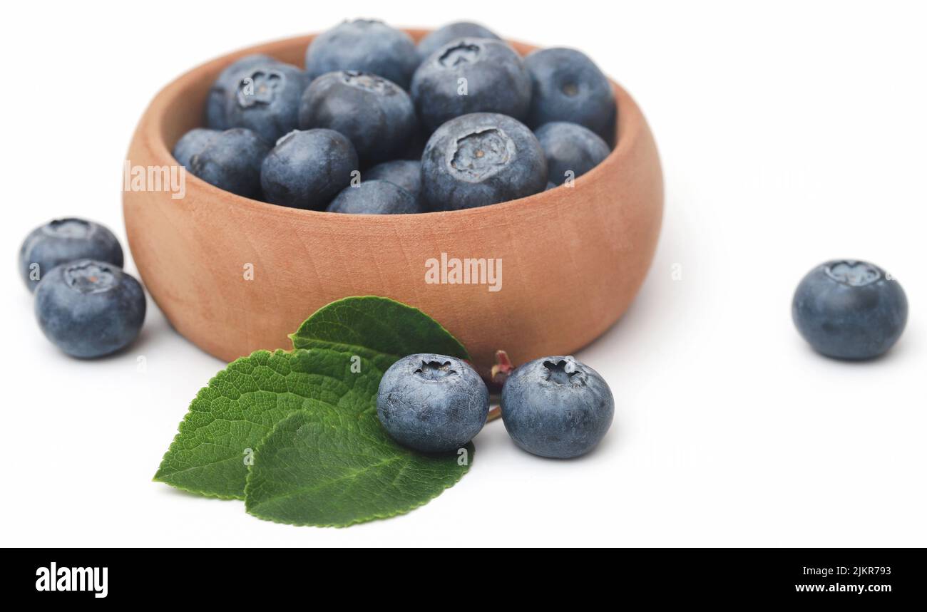 Fresh blueberries in a bowl over white background Stock Photo