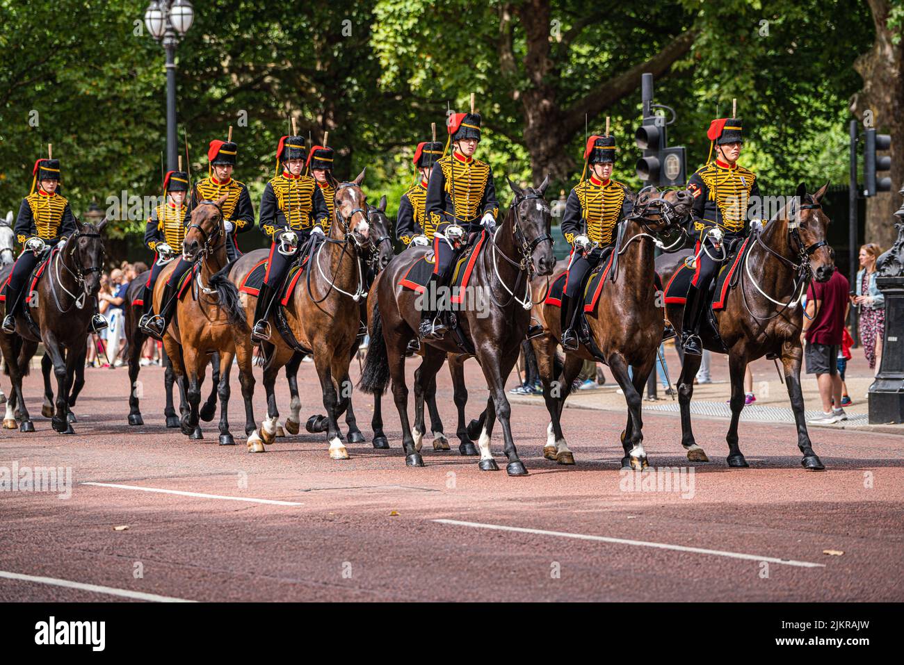 London, UK 3 August 2022. Members of the Kings Troop Horse Artillery  wearing gold braided uniforms and busby hats ride down the mall towards horse guards parade during the changing of the guards ceremony on a hot and humid day in London Credit. amer ghazzal/Alamy Live News Stock Photo