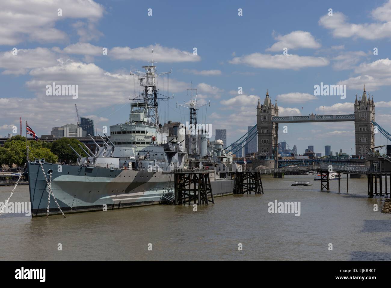 HMS Belfast, with the City of London skyscrapers and Tower Bridge in ...