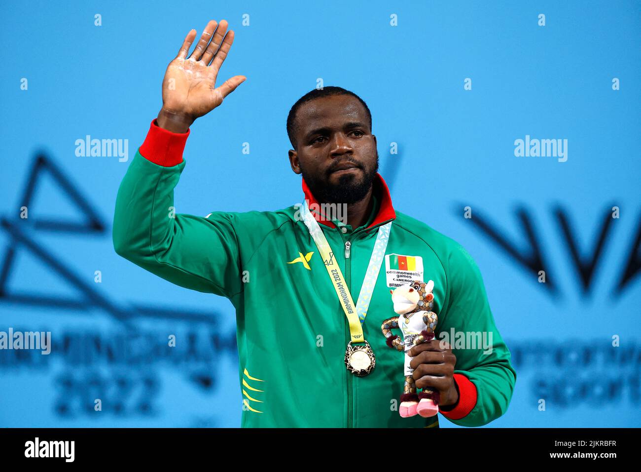 Commonwealth Games - Weightlifting - Men's 109kg - Final - The NEC Hall 1, Birmingham, Britain - August 3, 2022 Gold medallist Cameroon's Junior Periclex Ngadja Nyabeyeu celebrates on the podium during the medal ceremony REUTERS/Jason Cairnduff Stock Photo
