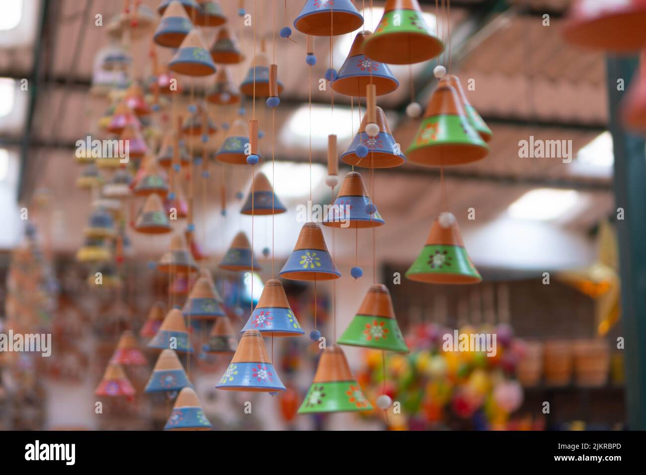 Decorative clay bells in a souvenir store. Handmade clay products. Ráquira, Colombia. Stock Photo