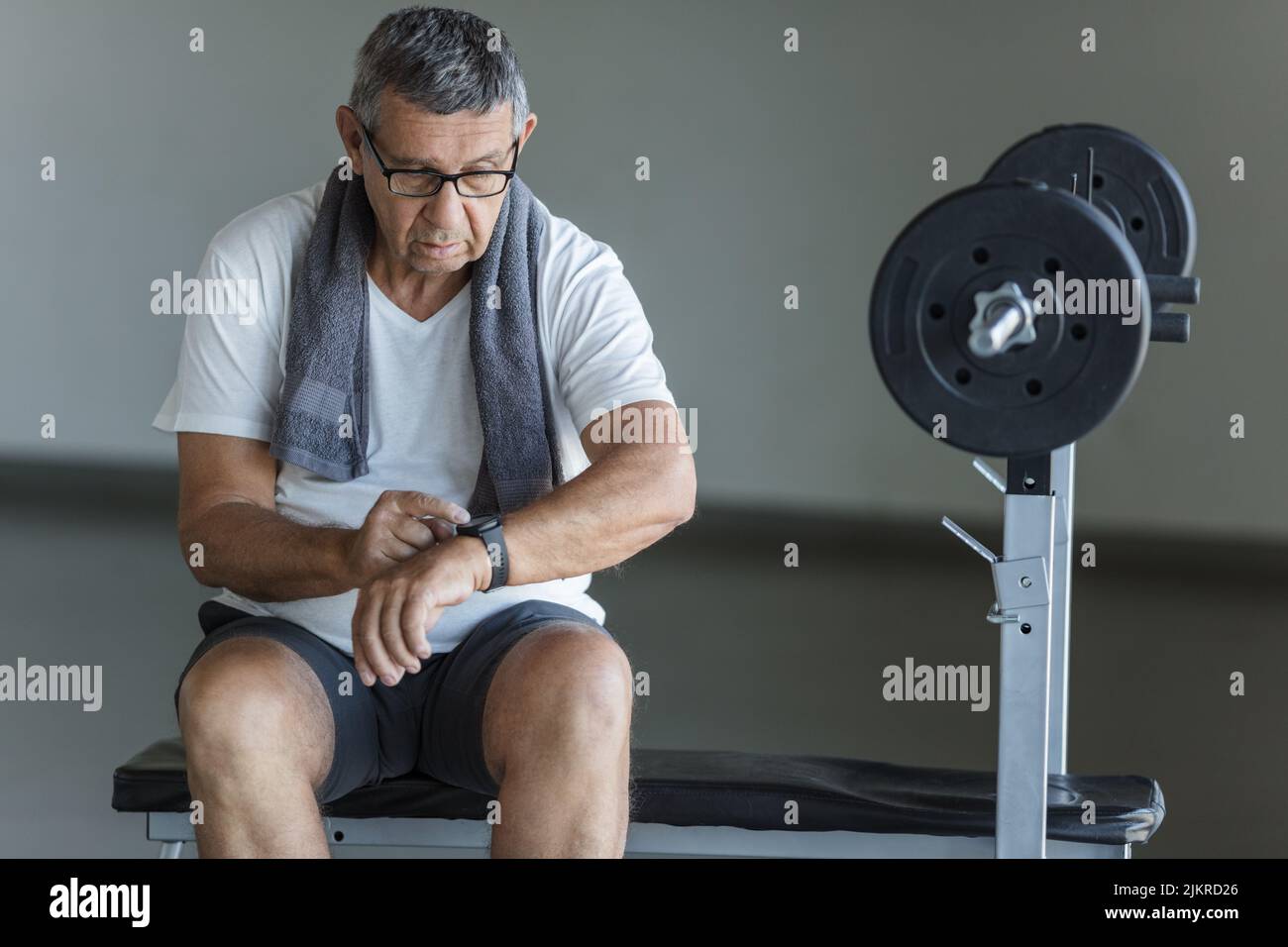 Active and healthy senior exercising in a gym Stock Photo