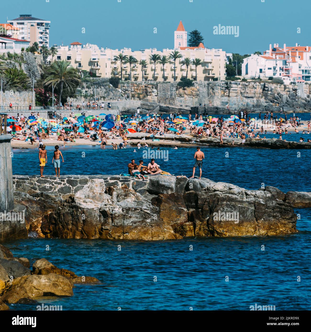 Crowded sandy Tamariz beach in Estoril near Lisbon, Portugal during the summer Stock Photo