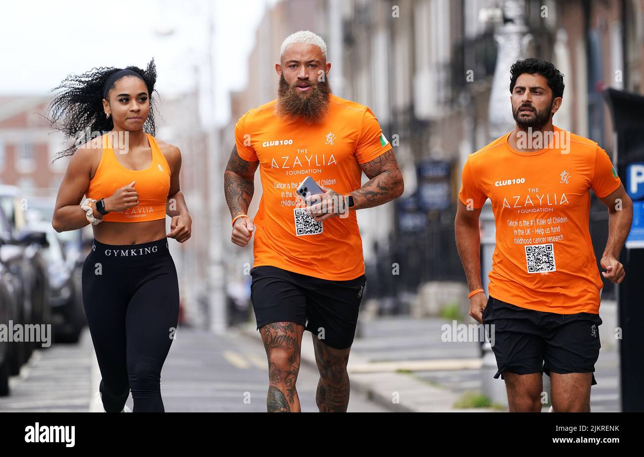 Ex-footballer Ashley Cain (centre) with his cousin Tamika Cain (left) and Rehan Khalid at Fitzwilliam Square in Dublin as he begins a charity run in memory of his late daughter Azaylia, and to raise funds in aid of childhood cancer, that will span across five capital cities in Ireland and the UK over the next five days. Picture date: Wednesday August 3, 2022. Stock Photo
