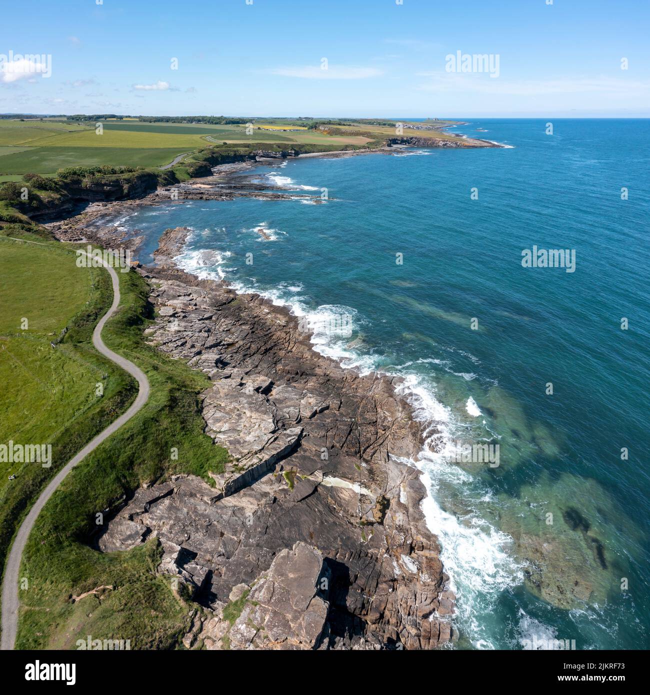 cullernose point from rumbling kern towards dunstanburgh castle elevated view Stock Photo