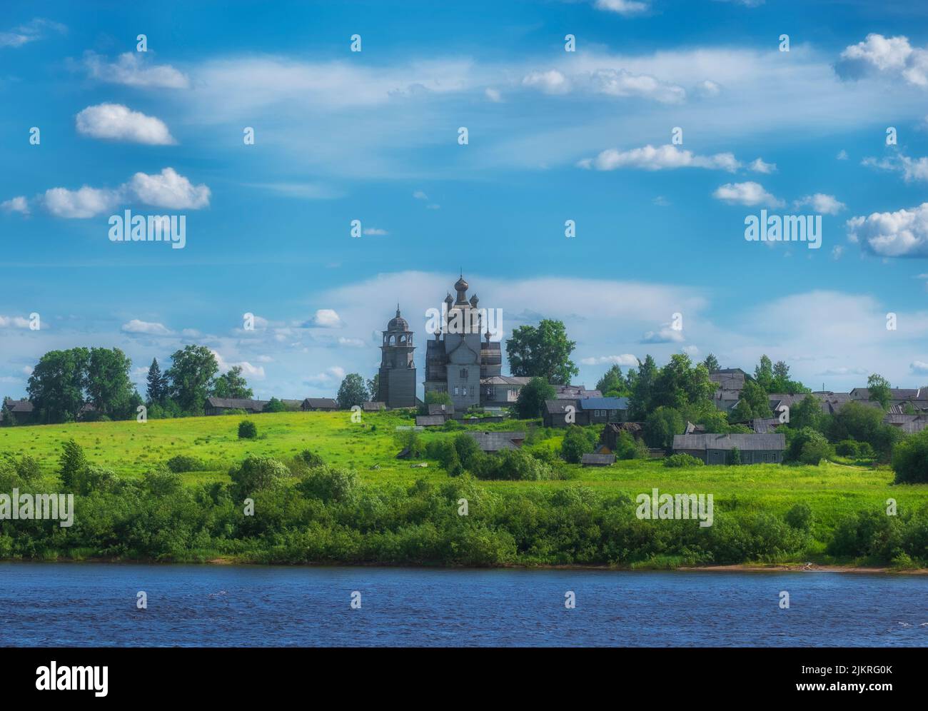 Arkhangelsk region, the village of Turchasovo near Onega River. the old wooden Church of the Transfiguration of 1786 and the bell tower of 1793. View Stock Photo